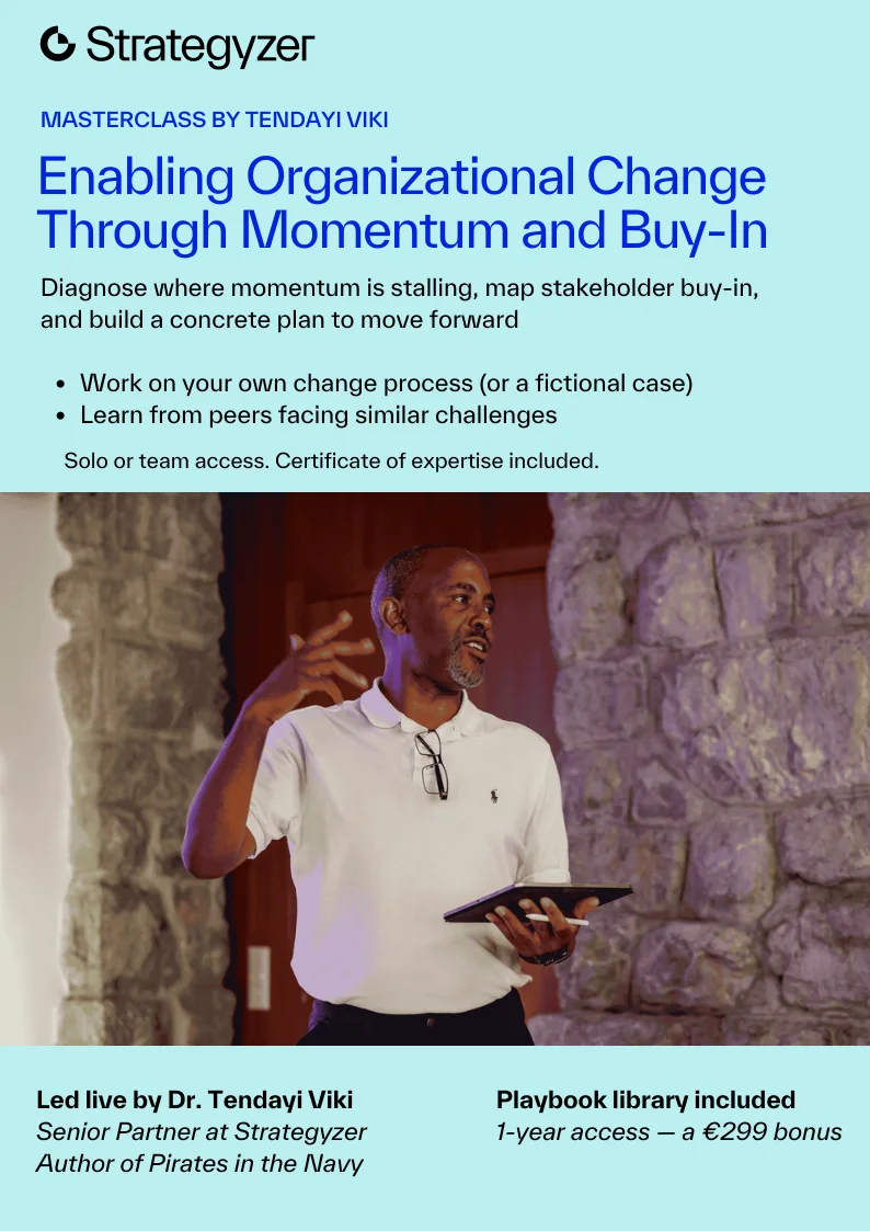 The old masterclass brochure cover: a pale aqua panel with the title in blue, a list of benefits and a photo of the facilitator on stage.
